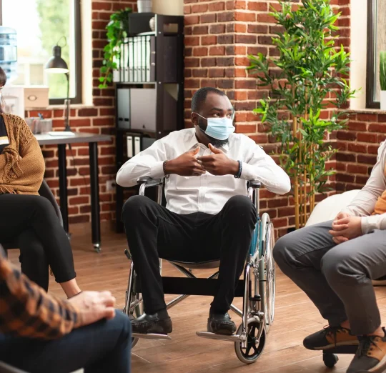 male-wheelchair-user-speaking-therapy