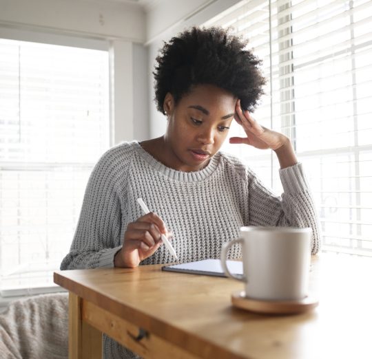 Woman working on a digital tablet in the new normal